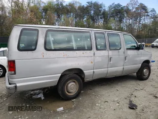 1999 Ford Econoline Passenger XL with VIN 1FBSS31LXXHA39417, listed as a Copart auction lot 52817645 with 109,930 mi miles and Salvage title. Bid and sale history available at DreamBid. Image 3.