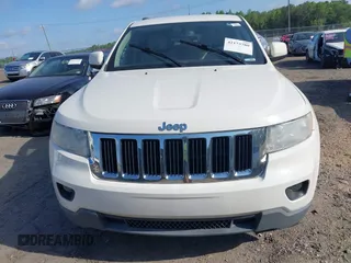 2011 Jeep Grand Cherokee Laredo with VIN 1J4RS4GGXBC517068, listed as a IAAI auction lot 42173780 with 170,688 mi miles and . Bid and sale history available at DreamBid. Image 6.