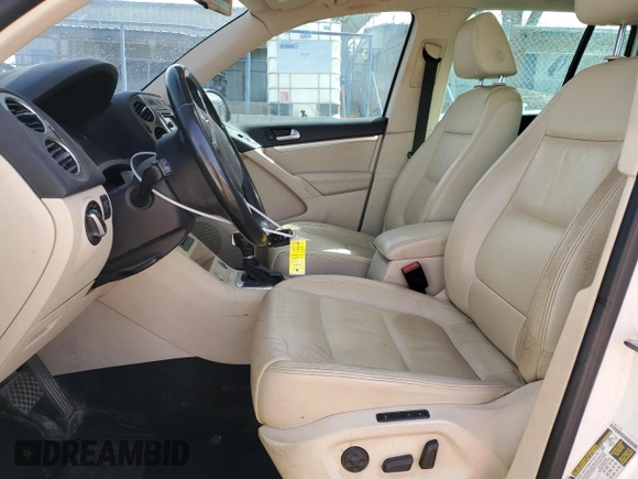 2012 Volkswagen Tiguan SE with VIN WVGAV7AX1CW530016, listed as a Copart auction lot 48551935 with 102,455 mi miles and Salvage Title. Bid and sale history available at DreamBid. Image 7.