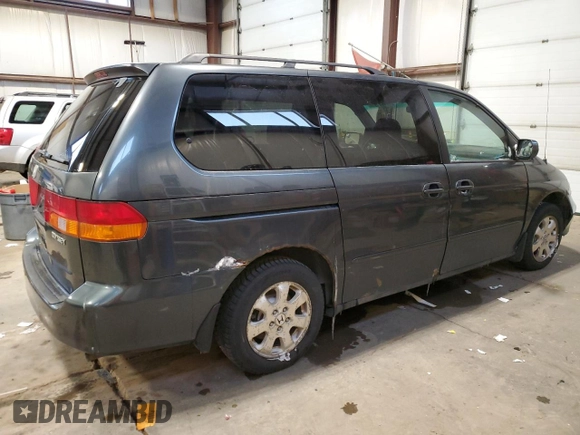2003 Honda Odyssey EX with VIN 2HKRL18603H008412, listed as a Copart auction lot 87502365 with 352,773 mi miles and Salvage Title. Bid and sale history available at DreamBid. Image 3.