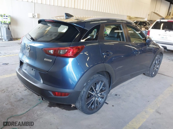 2018 Mazda CX-3 Touring with VIN JM1DKFC78J1323439, listed as a IAAI auction lot 41725784 with 134,055 mi miles. Bid and sale history available at carsss.com. Image 4.