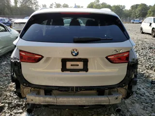2017 BMW X1 xDrive28i with VIN WBXHT3C33H5F70208, listed as a Copart auction lot 67999764 with 130,341 mi miles and Salvage Title. Bid and sale history available at carsss.com. Image 6.