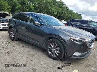 2019 Mazda CX-9 Touring with VIN JM3TCACY6K0334121, listed as a Copart auction lot 64901735 with 112,328 mi miles and Salvage title. Bid and sale history available at DreamBid. Image 4.