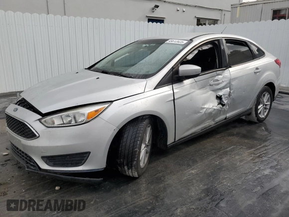 2018 Ford Focus SE z VIN 1FADP3F29JL272804, wystawiony jako Copart lot #49612625 z przebiegiem Nie podano mil oraz Czysty tytuł • Clean title. Historia ofert i sprzedaży dostępna na DreamBid. Obrazek 1.