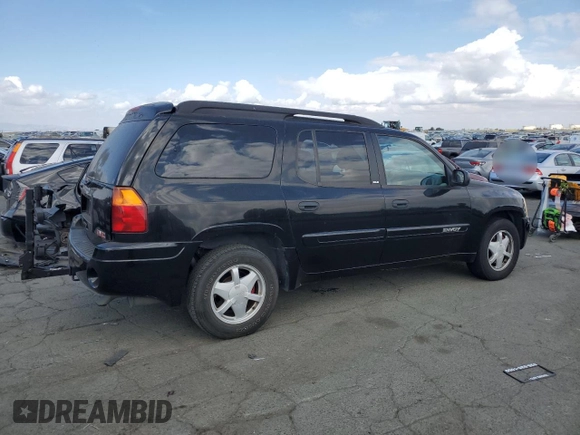 2003 GMC Envoy SLT with VIN 1GKES16SX36220489, listed as a Copart auction lot 71859834 with 148,811 mi miles and Salvage Title. Bid and sale history available at DreamBid. Image 3.