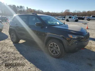 2022 Jeep Cherokee Trailhawk with VIN 1C4PJMBX5ND549237, listed as a Copart auction lot 83760264 with 24,756 mi miles and Salvage Title. Bid and sale history available at carsss.com. Image 4.