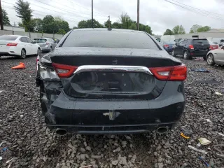 2017 Nissan Maxima SV z VIN 1N4AA6AP6HC455810, wystawiony jako Copart lot #56661335 z przebiegiem 102 552 mil mil oraz Szkoda całkowita • Salvage title. Historia ofert i sprzedaży dostępna na DreamBid. Obrazek 6.