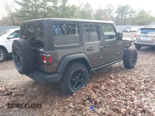2021 Jeep Wrangler Unlimited Sport S with VIN 1C4HJXDN4MW518307, listed as a IAAI auction lot 41222996 with 39,499 mi miles and . Bid and sale history available at DreamBid. Image 4.