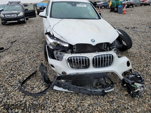 2019 BMW X1 sDrive28i with VIN WBXHU7C53K5L12037, listed as a Copart auction lot 65538082 with Not Provided miles and . Bid and sale history available at DreamBid. Image 9.