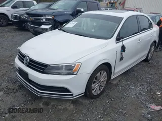 2015 Volkswagen Jetta Sedan 1.8T SE with VIN 3VWD17AJ6FM237674, listed as a IAAI auction lot 41613054 with 71,325 mi miles. Bid and sale history available at carsss.com. Image 2.