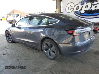 2020 Tesla Model 3 Standard Range Plus z VIN 5YJ3E1EA3LF803624, wystawiony jako Copart lot #56145255 z przebiegiem 149 398 mil mil oraz Szkoda całkowita • Salvage title. Historia ofert i sprzedaży dostępna na DreamBid. Obrazek 2.