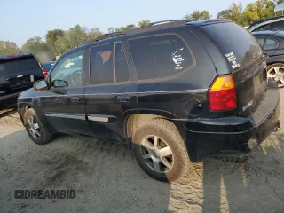 2004 GMC Envoy SLT with VIN 1GKDT13S942407244, listed as a Copart auction lot 70995064 with 162,676 mi miles and Salvage Title. Bid and sale history available at carsss.com. Image 2.
