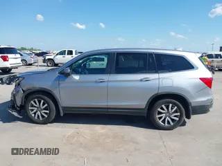 2020 Honda Pilot EX-L with VIN 5FNYF5H46LB004744, listed as a IAAI auction lot 42095298 with 76,159 mi miles and . Bid and sale history available at DreamBid. Image 13.