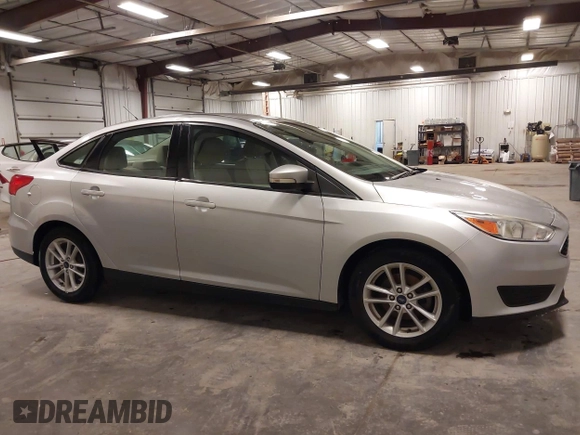 2017 Ford Focus SE z VIN 1FADP3F20HL245291, wystawiony jako IAAI lot #42194880 z przebiegiem 93 764 mil mil oraz . Historia ofert i sprzedaży dostępna na DreamBid. Obrazek 13.