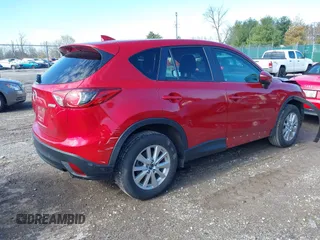 2016 Mazda CX-5 Touring with VIN JM3KE4CY5G0630438, listed as a IAAI auction lot 41877660 with 56,960 mi miles. Bid and sale history available at carsss.com. Image 4.