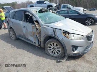 2015 Mazda CX-5 Touring with VIN JM3KE2CY6F0432910, listed as a IAAI auction lot 41784545 with 210,787 mi miles. Bid and sale history available at carsss.com. Image 1.