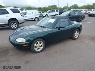 1999 Mazda MX-5 Miata with VIN JM1NB3532X0103631, listed as a IAAI auction lot 42063882 with 119,992 mi miles. Bid and sale history available at carsss.com. Image 2.