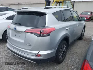 2016 Toyota RAV4 Hybrid XLE with VIN JTMRJREVXGD029019, listed as a IAAI auction lot 42021530 with 74,400 mi miles. Bid and sale history available at carsss.com. Image 4.