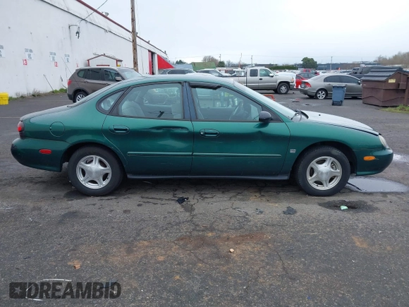 1999 Ford Taurus z VIN 1FAFP52S9XG309250, wystawiony jako IAAI lot #41797222 z przebiegiem 102 676 mil mil oraz . Historia ofert i sprzedaży dostępna na DreamBid. Obrazek 13.