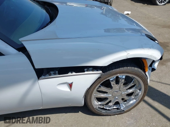 2007 Pontiac Solstice z VIN 1G2MB35B97Y141396, wystawiony jako IAAI lot #42443705 z przebiegiem 118 933 mil mil oraz . Historia ofert i sprzedaży dostępna na DreamBid. Obrazek 13.