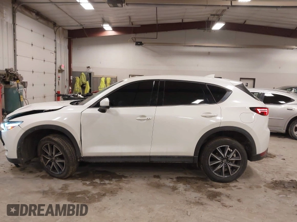 2018 Mazda CX-5 S Premium with VIN JM3KFBDM1J1412088, listed as a IAAI auction lot 41497431 with 65,532 mi miles and . Bid and sale history available at DreamBid. Image 14.