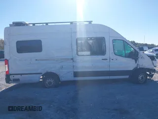 2022 Ford Transit Cargo with VIN 1FTBW3U85NKA01097, listed as a IAAI auction lot 41076643 with 24,786 mi miles and . Bid and sale history available at DreamBid. Image 6.