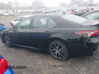 2023 Toyota Camry SE z VIN 4T1G11AK0PU809322, wystawiony jako IAAI lot #41056512 z przebiegiem 33 159 mil mil oraz . Historia ofert i sprzedaży dostępna na DreamBid. Obrazek 14.
