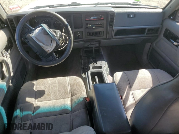 1995 Jeep Cherokee Sport with VIN 1J4FJ68S0SL646747, listed as a Copart auction lot 48772675 with 239,834 mi miles and Salvage title. Bid and sale history available at DreamBid. Image 8.