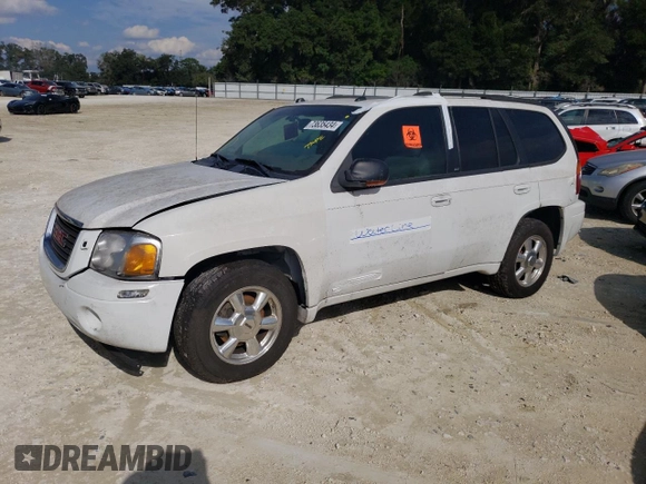 2005 GMC Envoy SLT with VIN 1GKDT13S052311455, listed as a Copart auction lot 73635434 with Not Provided miles and Salvage Title. Bid and sale history available at DreamBid. Image 1.