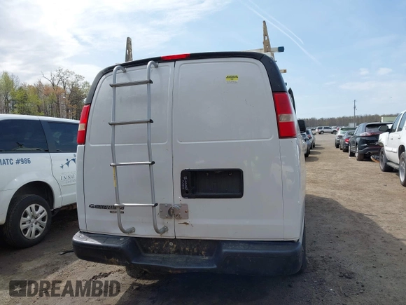 2014 Chevrolet Express Cargo Van with VIN 1GCWGFCA7E1110011, listed as a IAAI auction lot 41983301 with 114,827 mi miles. Bid and sale history available at carsss.com. Image 16.