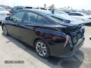 2017 Toyota Prius Two with VIN JTDKARFUXH3041668, listed as a IAAI auction lot 42421754 with 57,677 mi miles and . Bid and sale history available at DreamBid. Image 3.