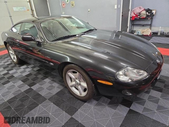 1997 Jaguar XK with VIN SAJGX5748VC006720, listed as a Copart auction lot 80928284 with 96,279 mi miles and Clean Title. Bid and sale history available at DreamBid. Image 1.