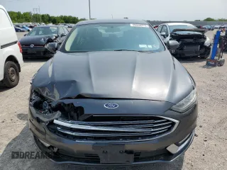 2017 Ford Fusion SE z VIN 3FA6P0H74HR390898, wystawiony jako Copart lot #58958275 z przebiegiem 159 799 mil mil oraz Szkoda całkowita • Salvage title. Historia ofert i sprzedaży dostępna na DreamBid. Obrazek 5.