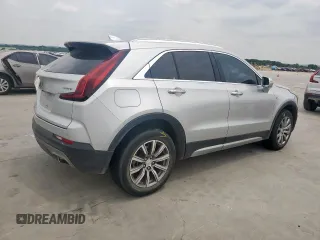 2021 Cadillac XT4 FWD Premium Luxury z VIN 1GYFZCR42MF004233, wystawiony jako Copart lot #57229385 z przebiegiem 98 387 mil mil oraz Szkody całkowita. Historia ofert i sprzedaży dostępna na DreamBid. Obrazek 3.