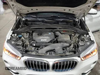 2017 BMW X1 xDrive28i with VIN WBXHT3Z38H4A53824, listed as a Copart auction lot 52500215 with 106,782 mi miles and Salvage title. Bid and sale history available at DreamBid. Image 13.