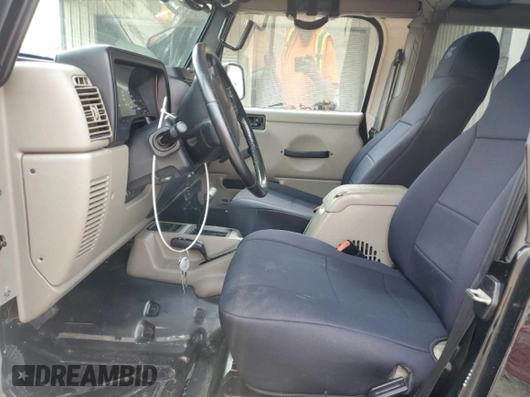 2004 Jeep Wrangler Sahara with VIN 1J4FA59SX4P722608, listed as a Copart auction lot 51223345 with 146,600 mi miles and Salvage title. Bid and sale history available at DreamBid. Image 7.