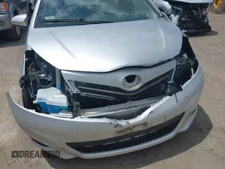 2014 Toyota Yaris L with VIN JTDJTUD38ED587118, listed as a IAAI auction lot 42211424 with 94,616 mi miles and . Bid and sale history available at DreamBid. Image 6.
