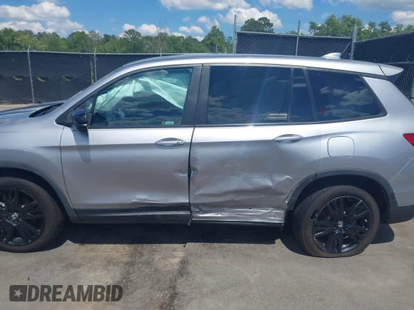 2021 Honda Passport Sport with VIN 5FNYF7H27MB003467, listed as a IAAI auction lot 42183219 with 52,156 mi miles and . Bid and sale history available at DreamBid. Image 14.