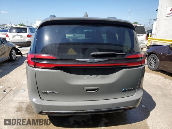 2021 Chrysler Pacifica Hybrid Touring L with VIN 2C4RC1L72MR599413, listed as a Copart auction lot 56419875 with 108,986 mi miles and Salvage title. Bid and sale history available at DreamBid. Image 6.