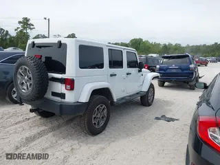2015 Jeep Wrangler Unlimited Rubicon Hard Rock with VIN 1C4HJWFG7FL684057, listed as a IAAI auction lot 41963885 with 103,240 mi miles. Bid and sale history available at carsss.com. Image 4.