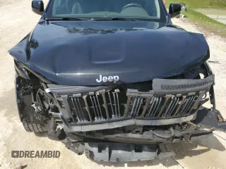 2013 Jeep Grand Cherokee Laredo with VIN 1C4RJEAG2DC519570, listed as a Copart auction lot 52066225 with 129,091 mi miles and Salvage Title. Bid and sale history available at carsss.com. Image 12.