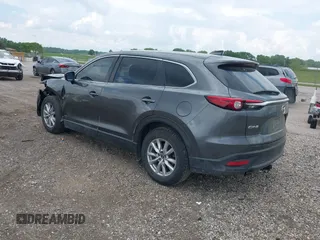 2016 Mazda CX-9 Sport z VIN JM3TCABYXG0126543, wystawiony jako IAAI lot #42256448 z przebiegiem 133 813 mil mil oraz . Historia ofert i sprzedaży dostępna na DreamBid. Obrazek 3.