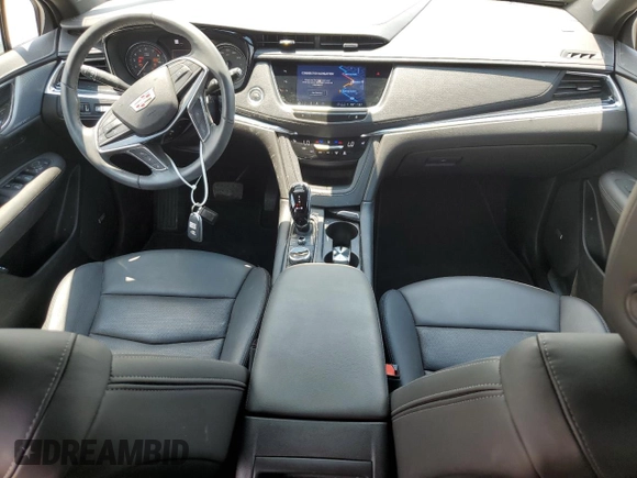 2023 Cadillac XT5 FWD Premium Luxury with VIN 1GYKNCRS3PZ135585, listed as a Copart auction lot 58891914 with 32,325 mi miles and Salvage Title. Bid and sale history available at carsss.com. Image 8.