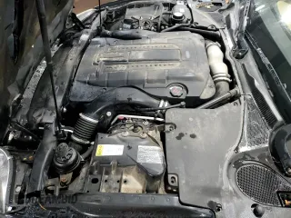 2007 Jaguar XK with VIN SAJWA43C479B18700, listed as a Copart auction lot 83377684 with 143,746 mi miles and Salvage Title. Bid and sale history available at carsss.com. Image 11.
