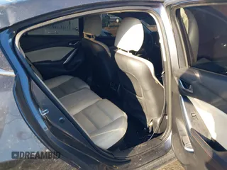 2014 Mazda 6 i Grand Touring with VIN JM1GJ1W50E1107877, listed as a IAAI auction lot 41857596 with 166,188 mi miles and . Bid and sale history available at DreamBid. Image 8.