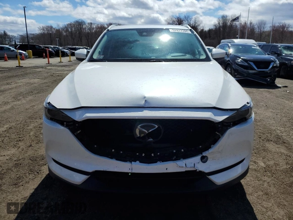 2020 Mazda CX-5 Grand Touring with VIN JM3KFBDM9L1803881, listed as a Copart auction lot 52822395 with 49,604 mi miles and Salvage Title. Bid and sale history available at carsss.com. Image 5.