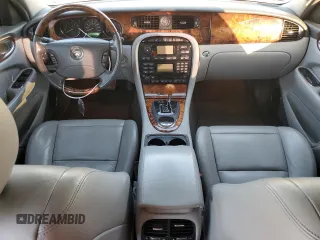 2004 Jaguar XJ with VIN SAJWA71C74SG20299, listed as a Copart auction lot 79469504 with 78,134 mi miles and Salvage Title. Bid and sale history available at carsss.com. Image 8.