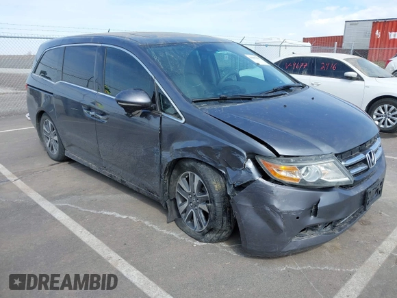 2014 Honda Odyssey Touring with VIN 5FNRL5H91EB093540, listed as a IAAI auction lot 41887412 with 202,076 mi miles and . Bid and sale history available at DreamBid. Image 1.