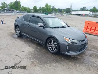 2015 Scion tC z VIN JTKJF5C75F3089895, wystawiony jako IAAI lot #42226465 z przebiegiem 106 694 mil mil oraz . Historia ofert i sprzedaży dostępna na DreamBid. Obrazek 1.