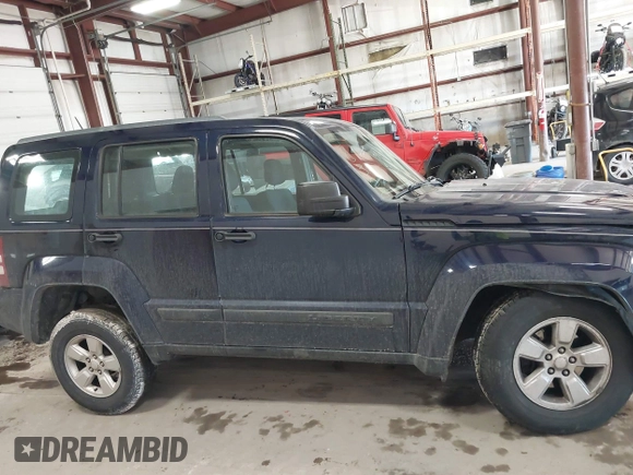 2012 Jeep Liberty Sport z VIN 1C4PJMAK9CW158308, wystawiony jako IAAI lot #41665502 z przebiegiem 125 595 mil mil oraz . Historia ofert i sprzedaży dostępna na DreamBid. Obrazek 13.